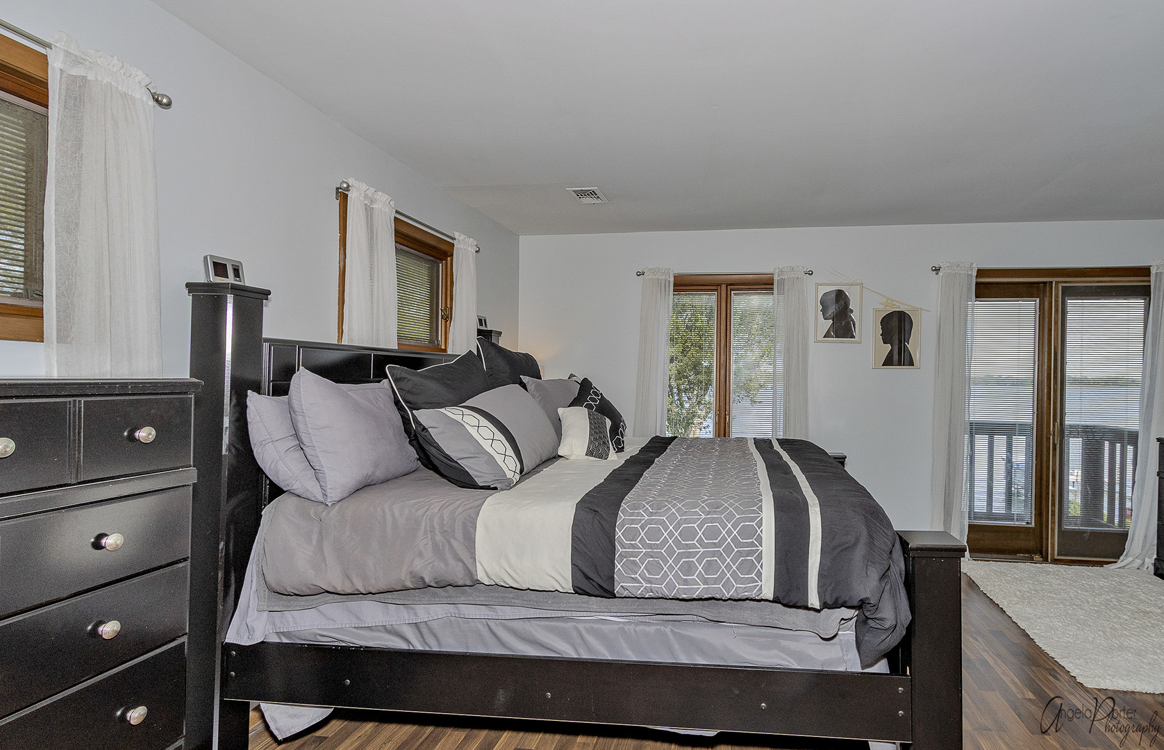 520 Bald Knob Road Johnsburg, IL 60051 - Photo 25 of 53 a bedroom with a large bed and a dresser