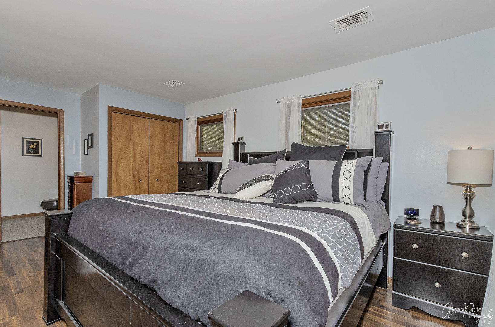 520 Bald Knob Road Johnsburg, IL 60051 - Photo 27 of 53 a bedroom with a bed and wooden floor