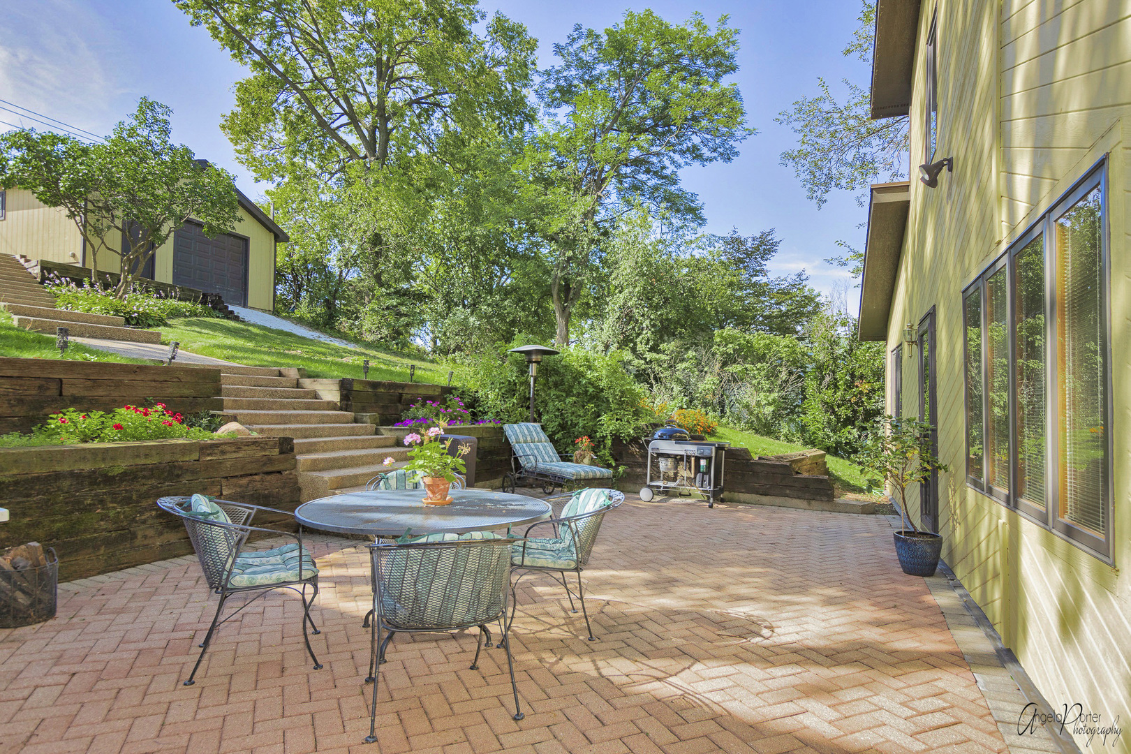 520 Bald Knob Road Johnsburg, IL 60051 - Photo 43 of 53 a view of a patio with table and chairs and potted plants