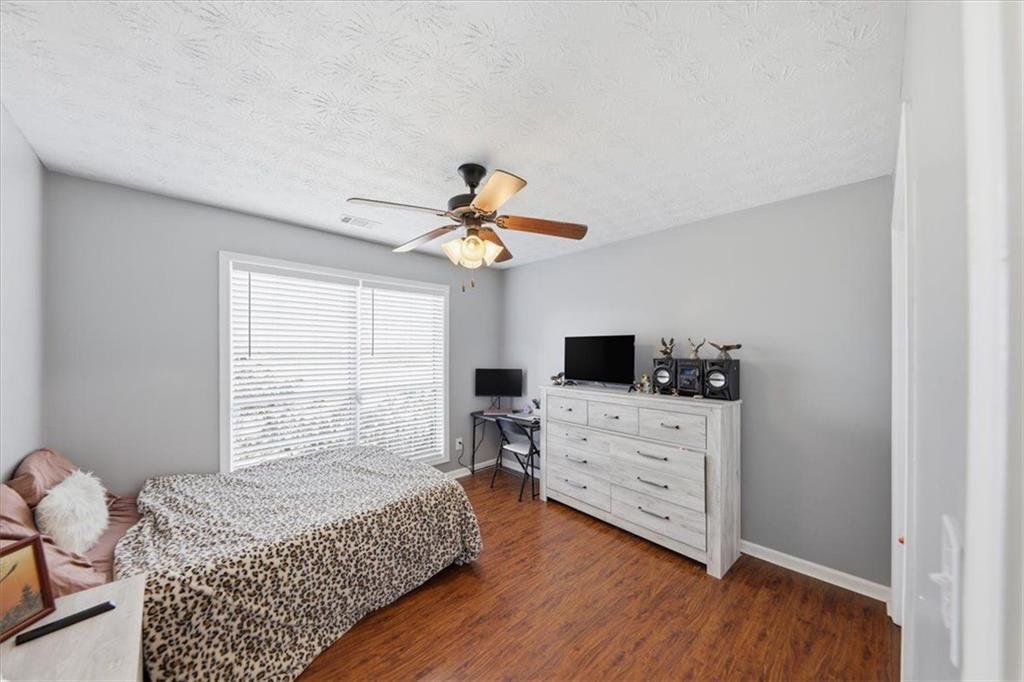 493 Youth Jersey Road Covington, GA 30014 - Photo 20 of 52 a bedroom with a bed and a window