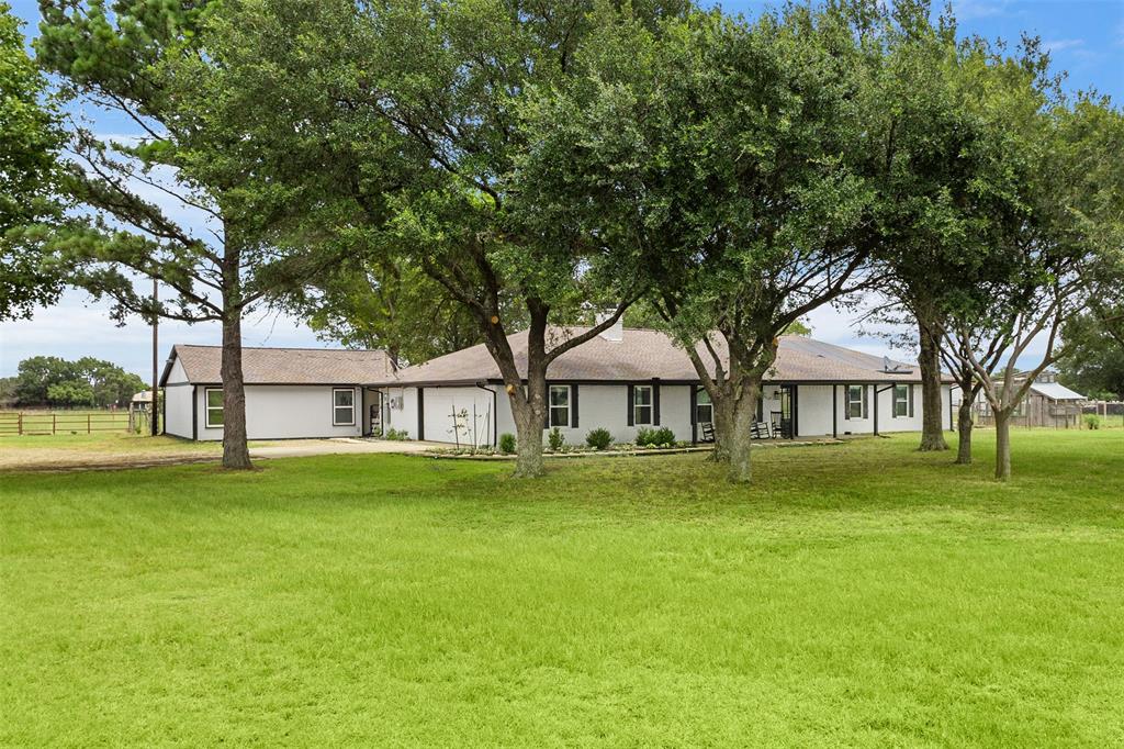 6754 Raymond Road Kaufman, TX 75142 - Photo 37 of 38 Expansive front lawn with mature trees providing natural shading