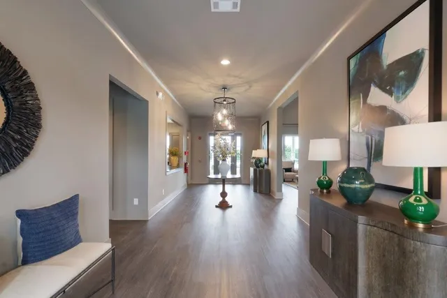a lobby with furniture and wooden floor