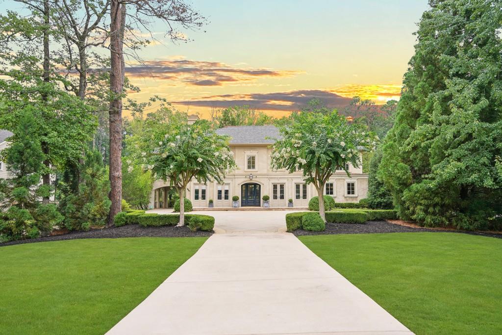 251 Pineland Road Northwest Atlanta, GA 30342 - Photo 1 of 1 a front view of a house with a yard and trees