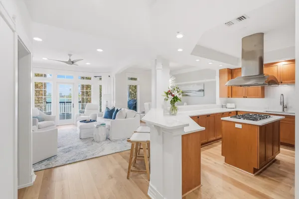 a kitchen with stainless steel appliances granite countertop a stove and a sink