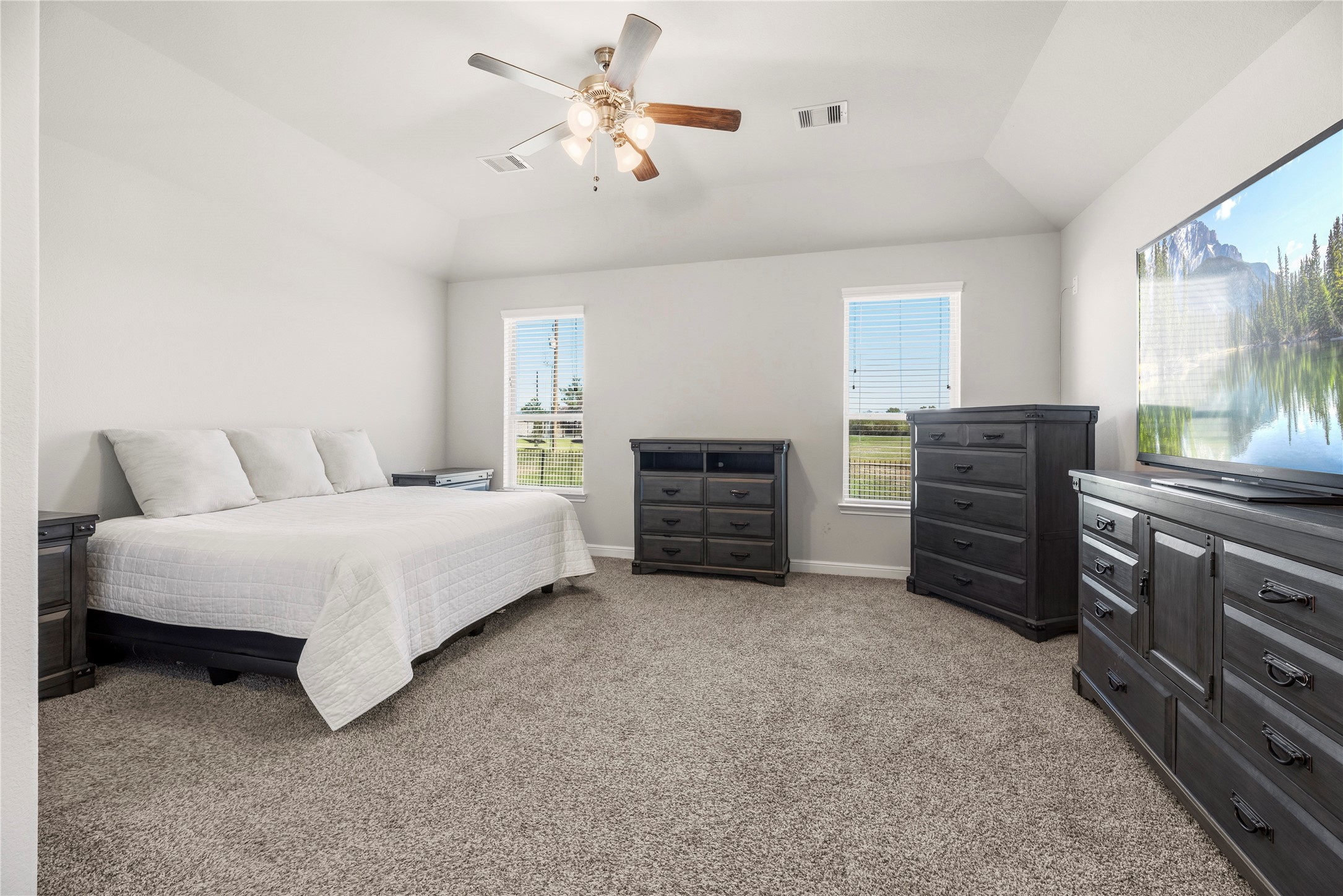 3319 Learning Tree Lane Rosenberg, TX 77471 - Photo 10 of 44 Unwind in style every evening with this serene primary suite, featuring spacious design and abundant natural light for ultimate relaxation.