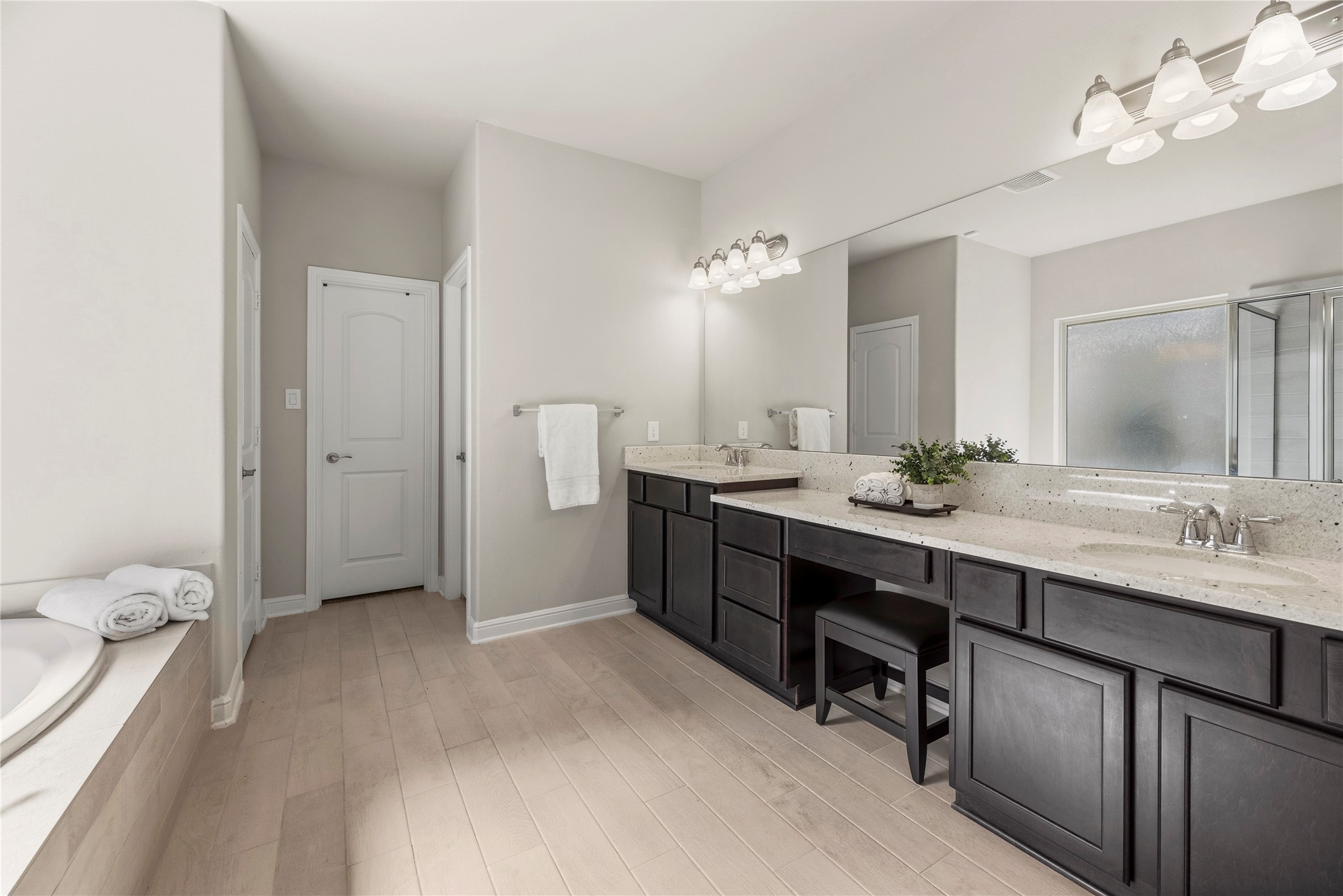 3319 Learning Tree Lane Rosenberg, TX 77471 - Photo 13 of 44 Dual sinks ensure both partners have a dedicated area for grooming and self-care! Ample counter space is only enhanced by the tremendous space beneath, which includes multiple drawers of varying sizes and base storage cabinetry!