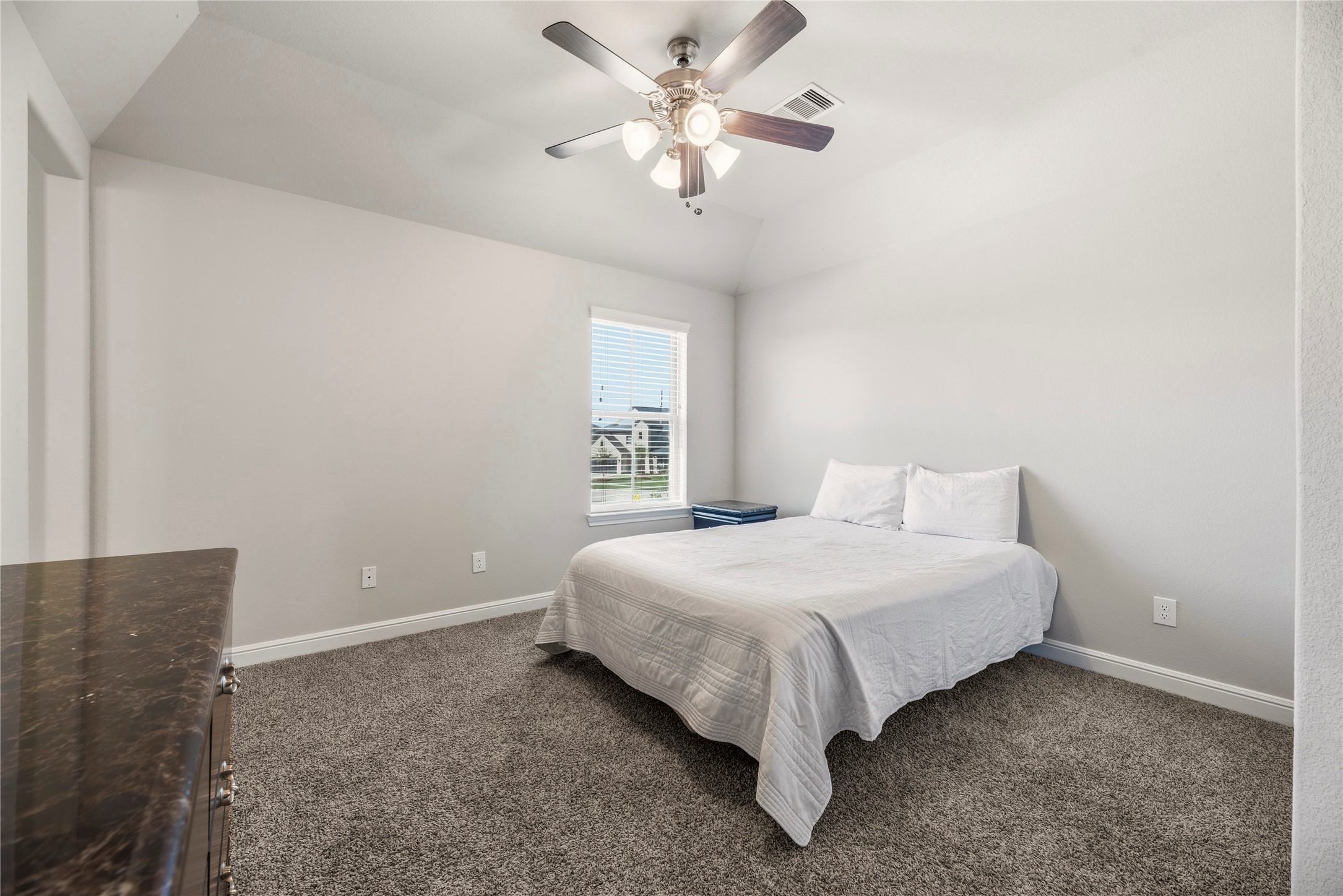 3319 Learning Tree Lane Rosenberg, TX 77471 - Photo 25 of 44 Whether a tiny princess or a little prince, every child would enjoy having such an attractive and big bedroom. Soft carpet ensures safe play, while the ceiling fan keeps them cool and happy.