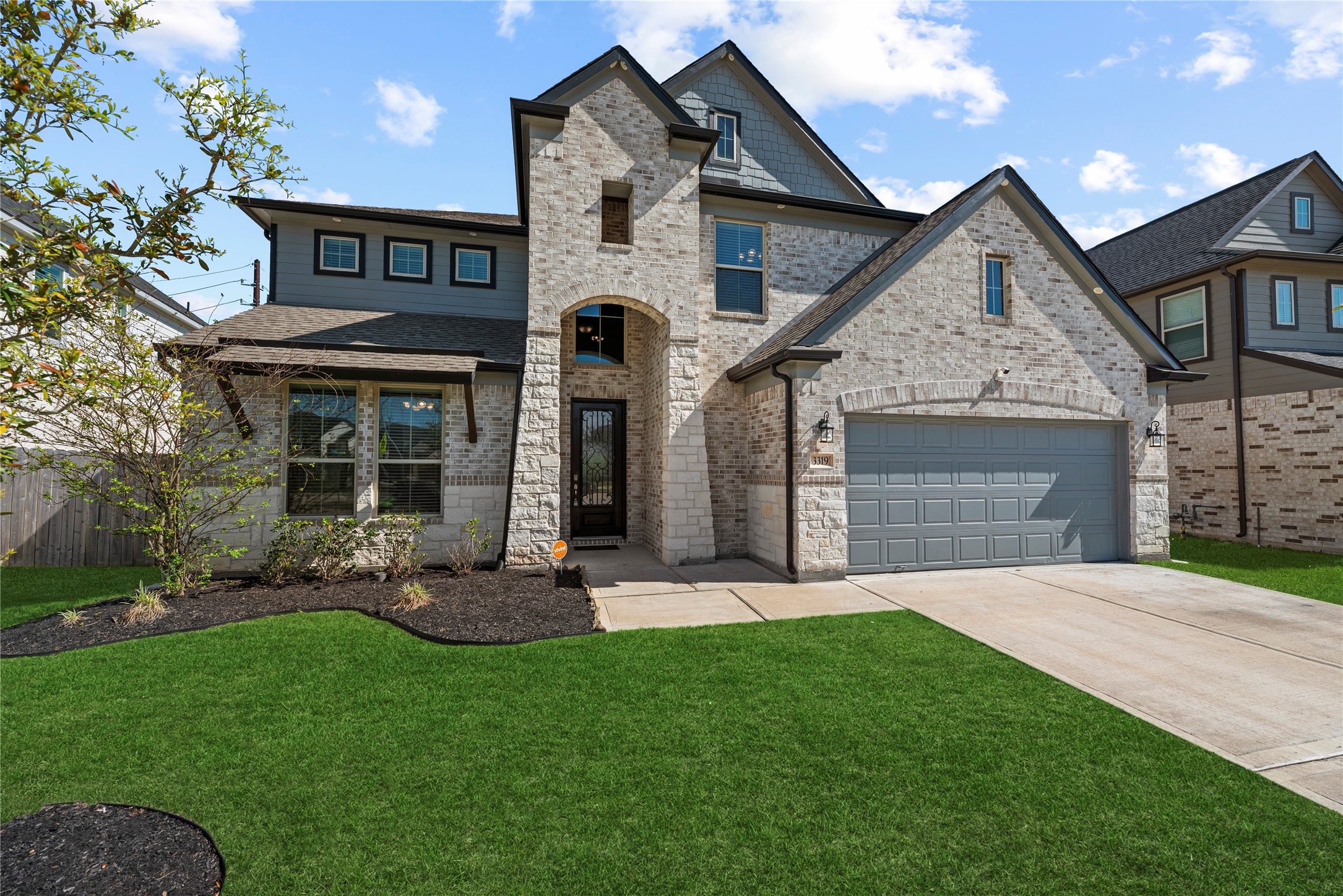 3319 Learning Tree Lane Rosenberg, TX 77471 - Photo 42 of 44 Home features an oversized two-car garage and a double driveway.