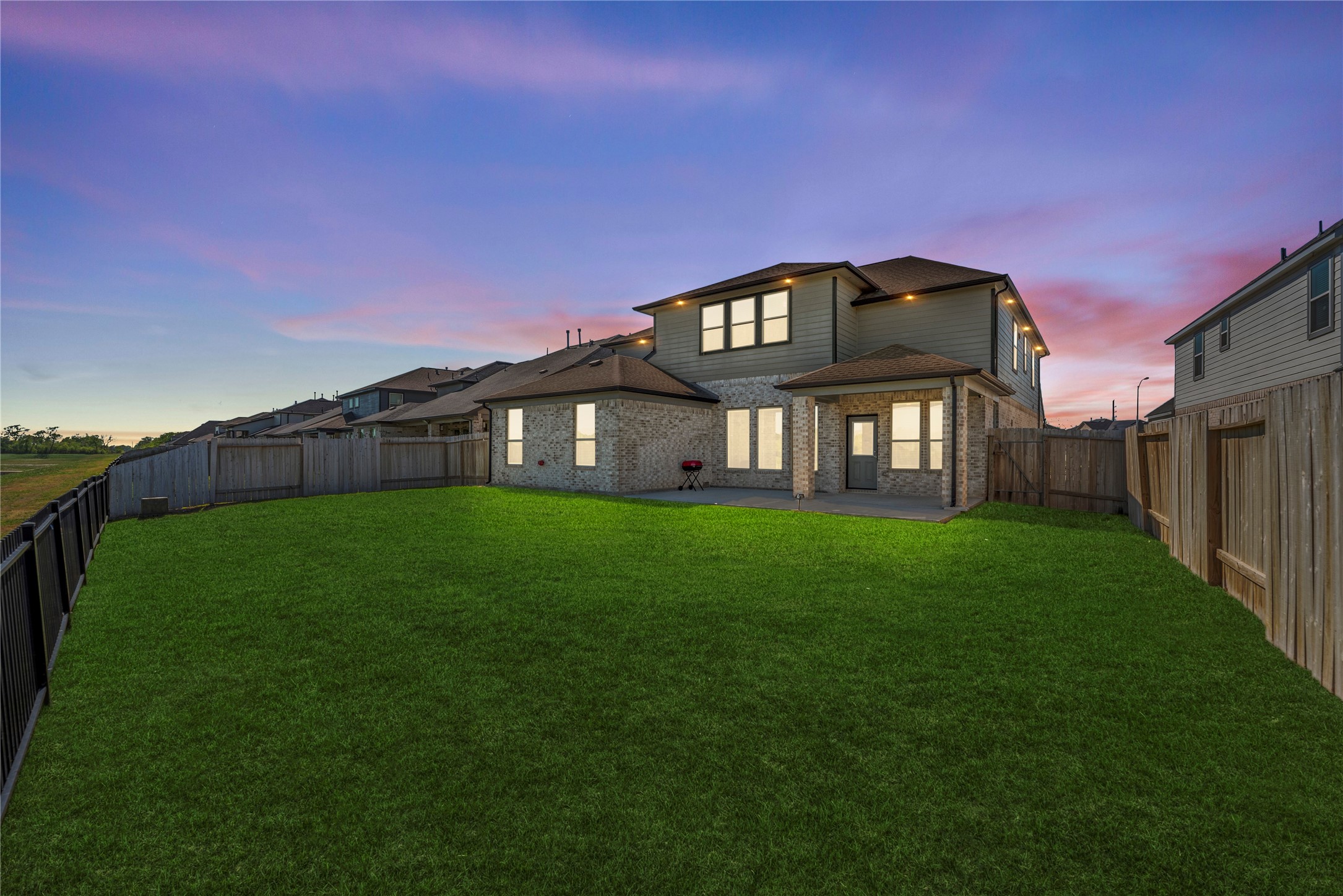 3319 Learning Tree Lane Rosenberg, TX 77471 - Photo 43 of 44 Upgrades include elegant soffit lighting that enhances the home’s exterior ambiance and visibility, along with a full sprinkler system designed to keep the lawn and landscaping lush and well-maintained with ease.