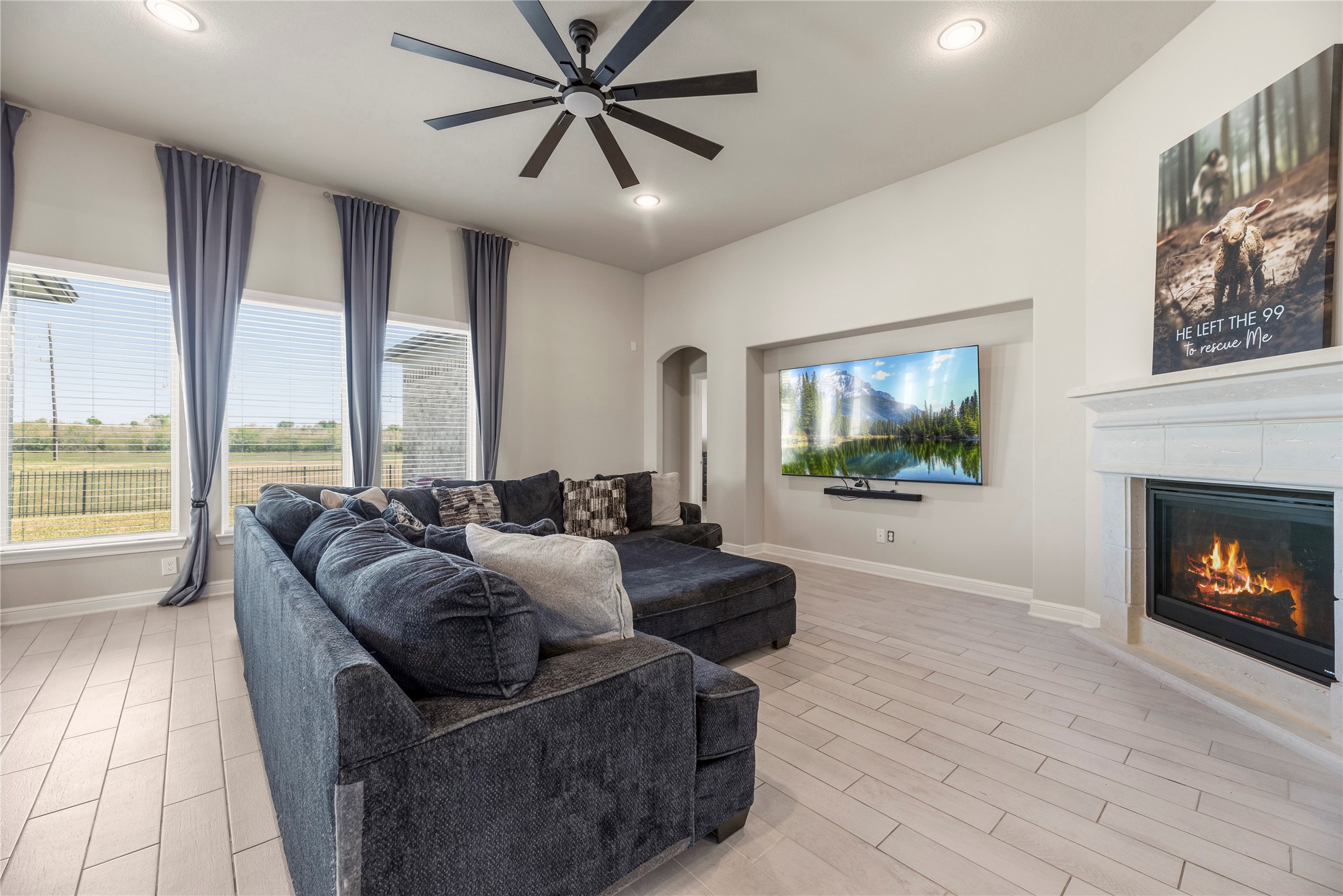 3319 Learning Tree Lane Rosenberg, TX 77471 - Photo 8 of 44 Welcoming and conveying warmth, the living room offers an inviting space for evening movies or holiday gatherings. Tune into your favorite streaming show, while admiring the cozy fireplace.