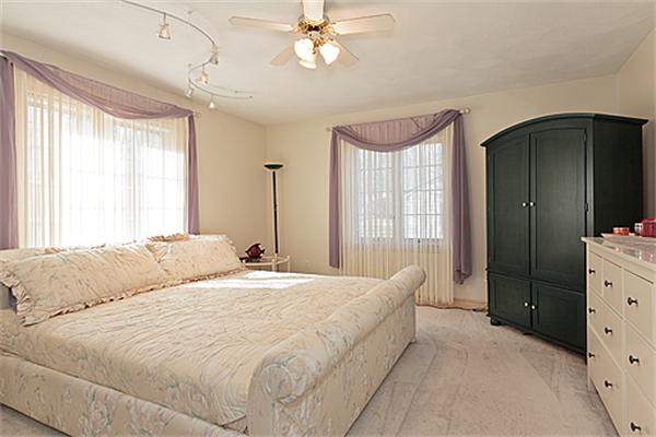 14 Apache Trail Arlington, MA 02474 - Photo 16 of 29 a bedroom with a bed and a dresser