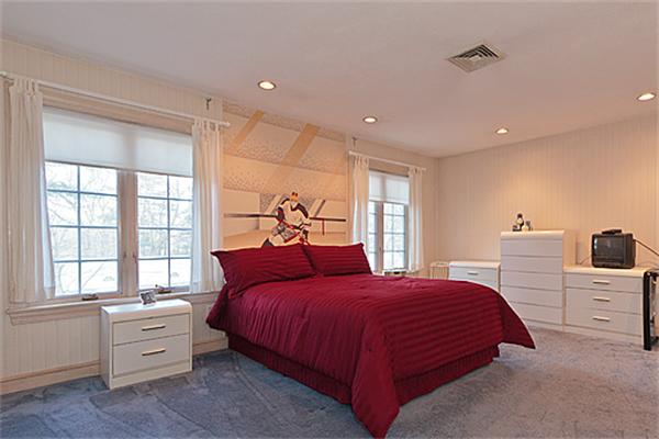 14 Apache Trail Arlington, MA 02474 - Photo 20 of 29 a bedroom with a bed and a dresser