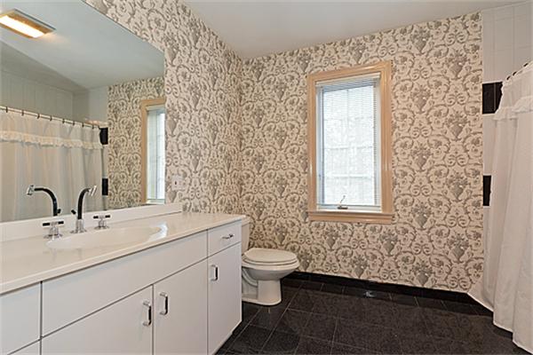 14 Apache Trail Arlington, MA 02474 - Photo 21 of 29 a bathroom with a sink a toilet and shower