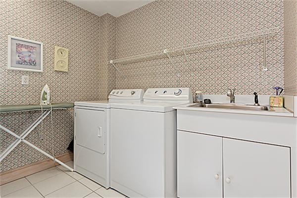 14 Apache Trail Arlington, MA 02474 - Photo 22 of 29 a utility room with dryer and washer