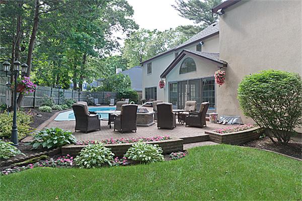 14 Apache Trail Arlington, MA 02474 - Photo 25 of 29 a view of a house with backyard and sitting area
