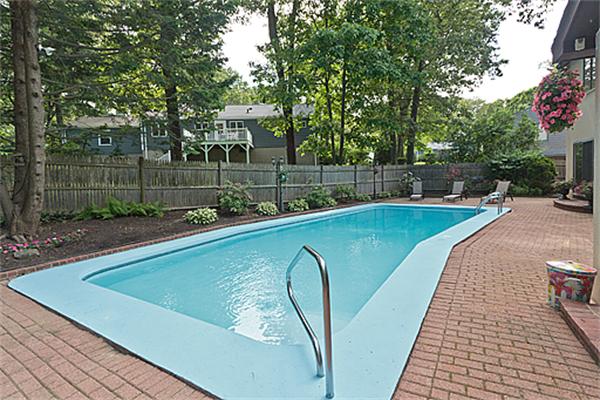 14 Apache Trail Arlington, MA 02474 - Photo 28 of 29 a view of a swimming pool with a patio