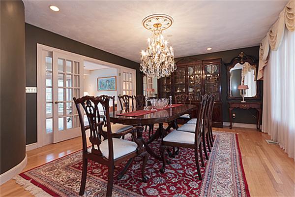 14 Apache Trail Arlington, MA 02474 - Photo 6 of 29 a view of a dining room with furniture a chandelier and wooden floor