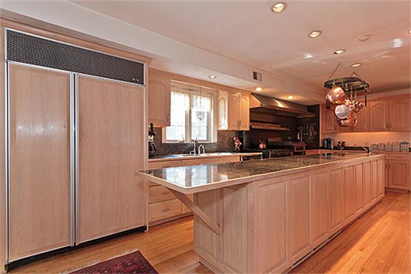 14 Apache Trail Arlington, MA 02474 - Photo 8 of 29 a large kitchen with kitchen island a large counter top space a sink a window and stainless steel appliances