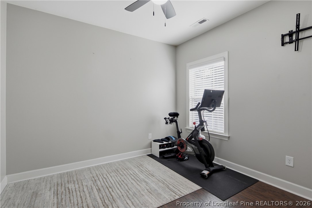 148 Heatherspring Way Spring Lake, NC 28390 - Photo 34 of 50 a room with gym equipment and windows
