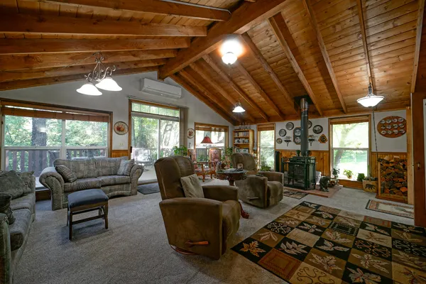 a large kitchen with stainless steel appliances granite countertop a lot of counter space and a dining table