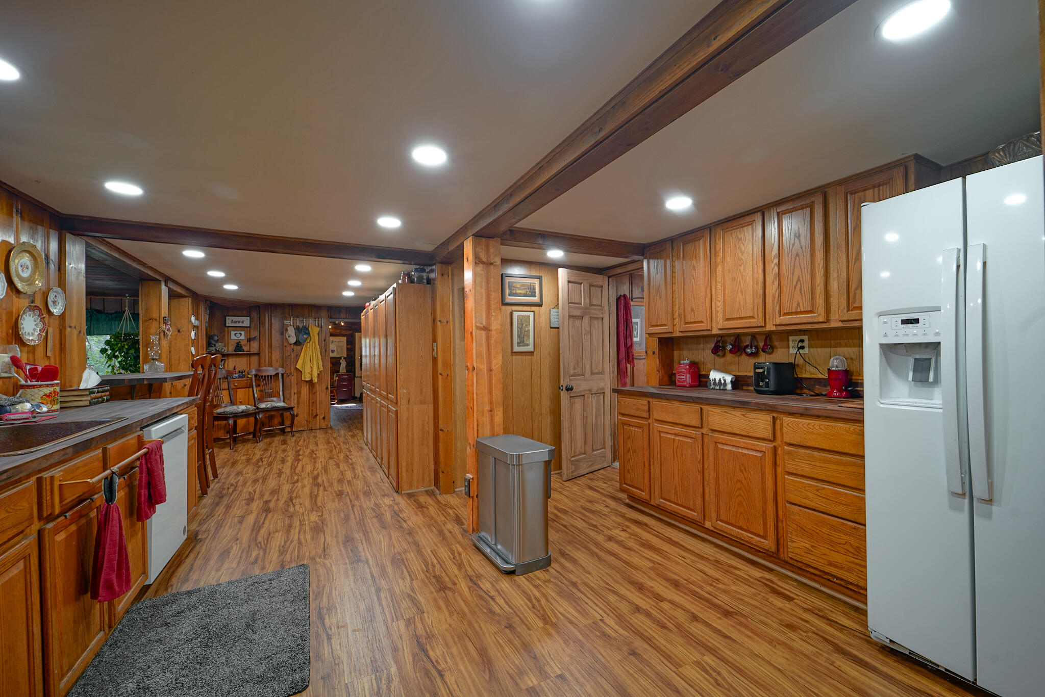 420 Price Creek Road Big Bar, CA 96010 - Photo 23 of 63 a kitchen with stainless steel appliances granite countertop a refrigerator a stove top oven a sink and dishwasher with wooden floor