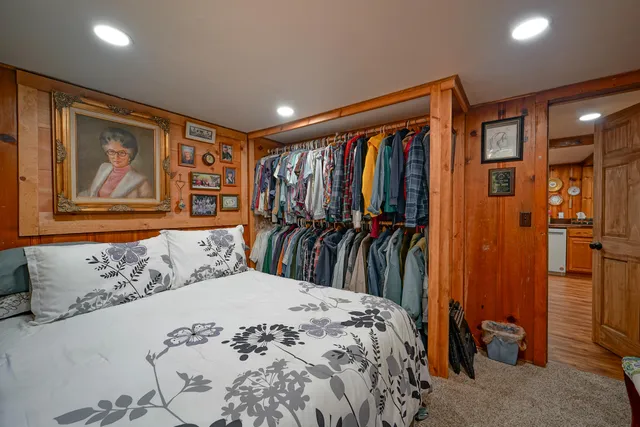 a bedroom with bed and a window