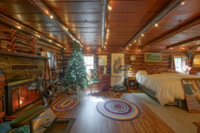 a view of a patio with couches table and chairs and wooden floor