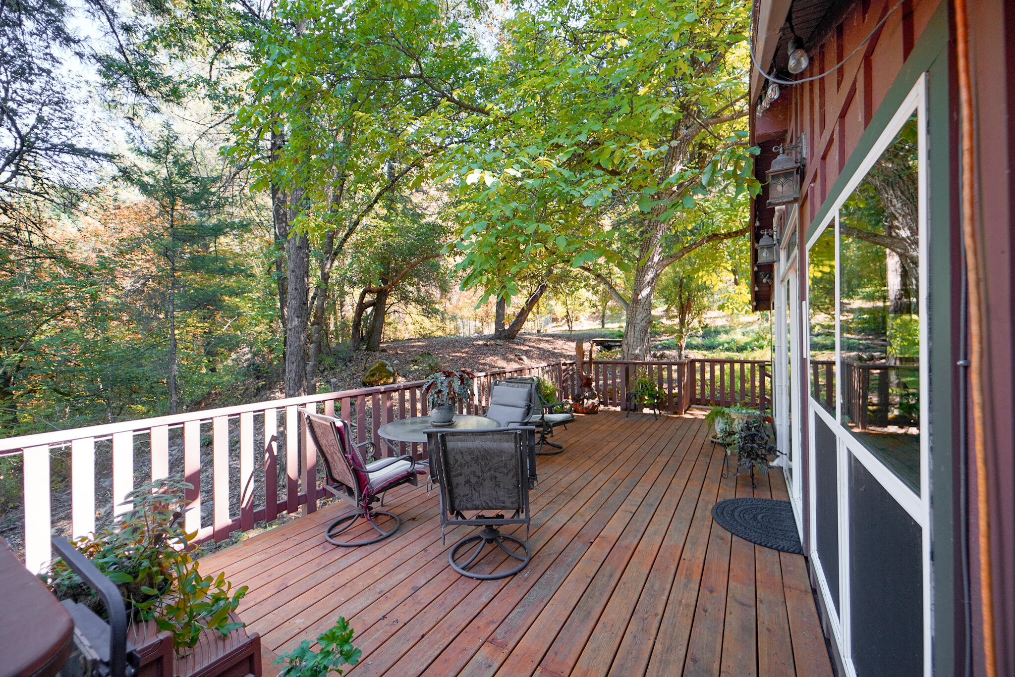 420 Price Creek Road Big Bar, CA 96010 - Photo 44 of 63 a view of a deck with chairs and wooden floor