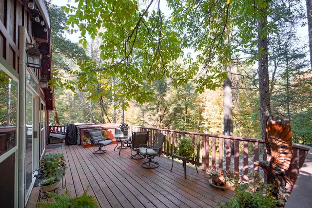 a backyard of a house with lots of green space and mountain view