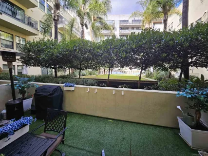 a view of a backyard with sitting area
