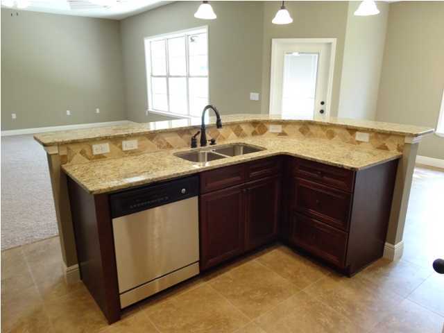 4644 Hermosa Road Crestview, FL 32539 - Photo 14 of 30 a kitchen with a sink and a mirror