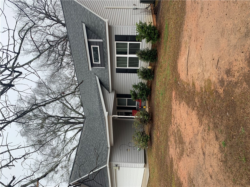 505 Blue Ridge Avenue Belton, SC 29627 - Photo 1 of 17 This inviting home offers a welcoming facade with classic residential architecture.