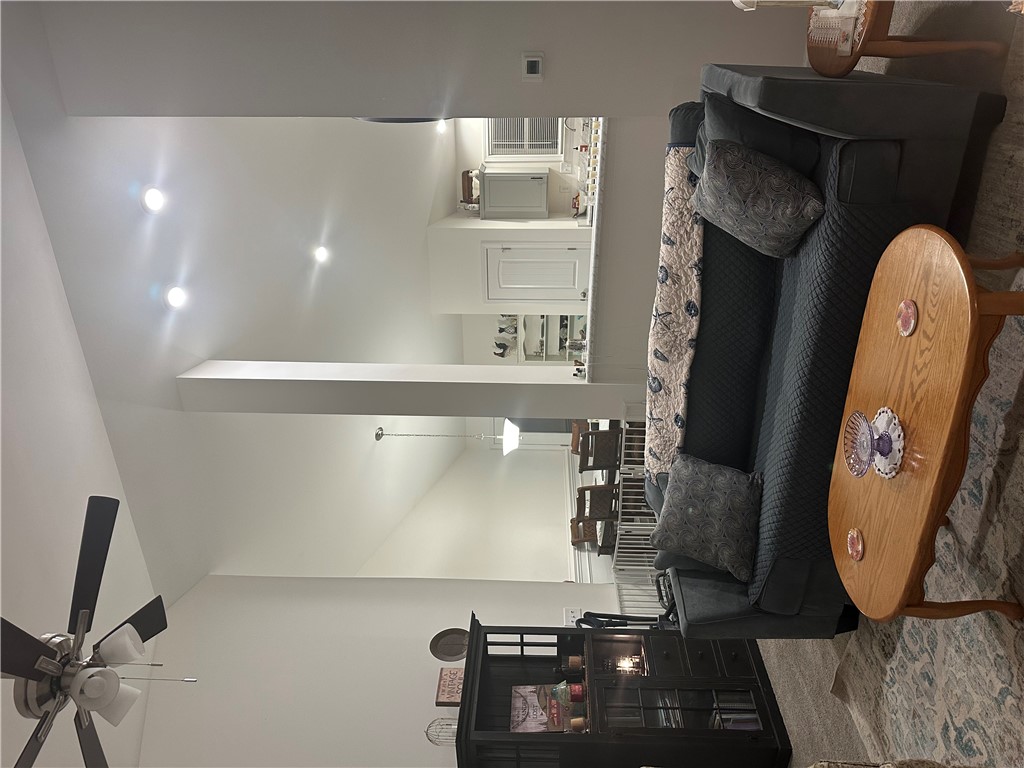 505 Blue Ridge Avenue Belton, SC 29627 - Photo 10 of 17 This inviting living space features high ceilings and a seamless transition to the kitchen, perfect for entertaining.
