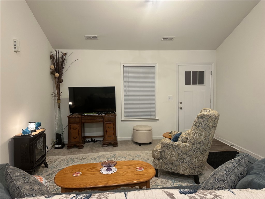 505 Blue Ridge Avenue Belton, SC 29627 - Photo 11 of 17 This inviting living area features a warm ambiance, perfect for relaxing.