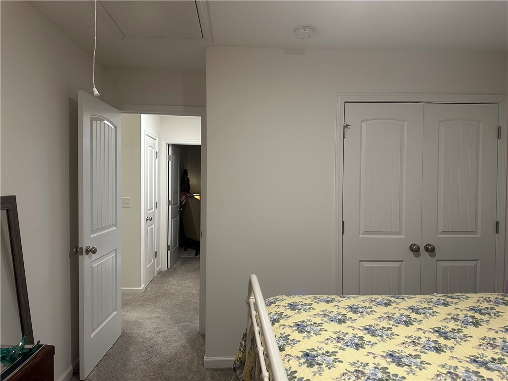 505 Blue Ridge Avenue Belton, SC 29627 - Photo 13 of 17 This spacious bedroom offers ample storage and easy access to additional living areas.