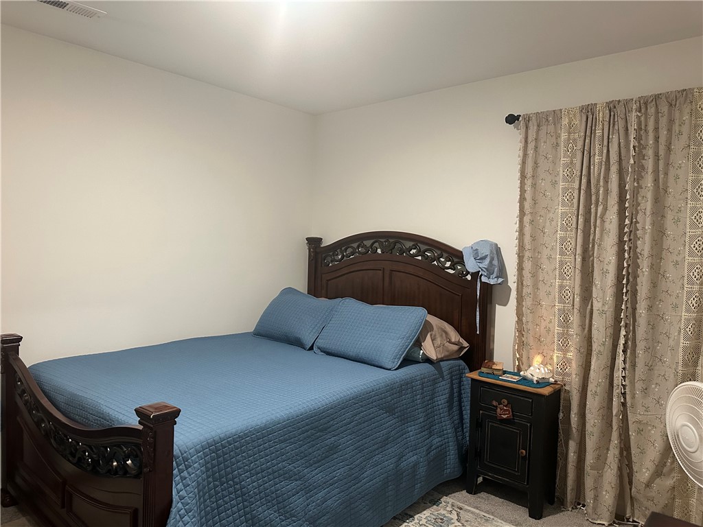 505 Blue Ridge Avenue Belton, SC 29627 - Photo 14 of 17 This cozy bedroom features a window for natural light and ample closet space.