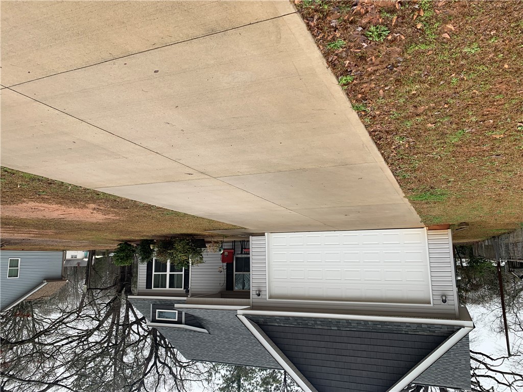 505 Blue Ridge Avenue Belton, SC 29627 - Photo 15 of 17 This charming residence features a well-maintained exterior and a practical driveway.