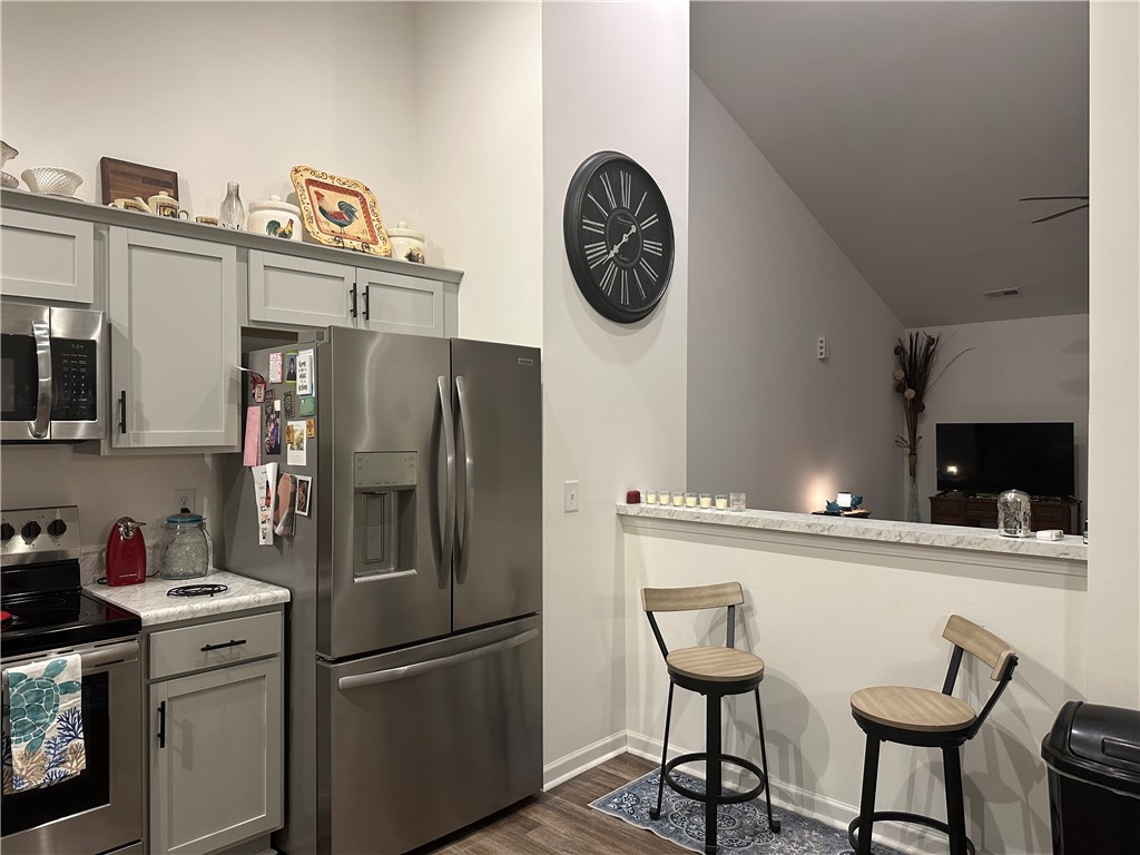 505 Blue Ridge Avenue Belton, SC 29627 - Photo 16 of 17 This modern kitchen seamlessly flows into the living area, creating an inviting open floorplan.
