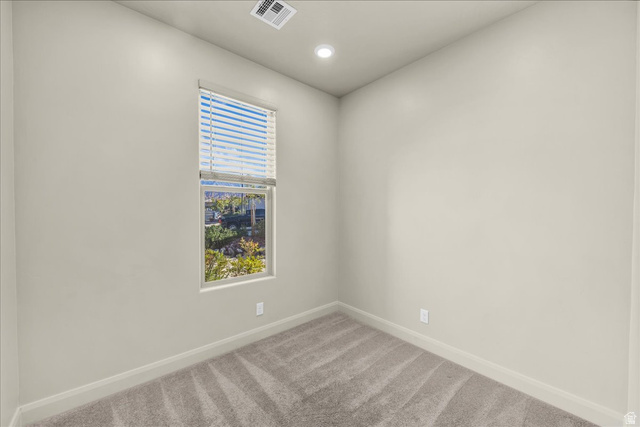 794 North Via Modelo Circle Washington, UT 84780 - Photo 11 of 21 Spare room featuring light colored carpet and recessed lighting