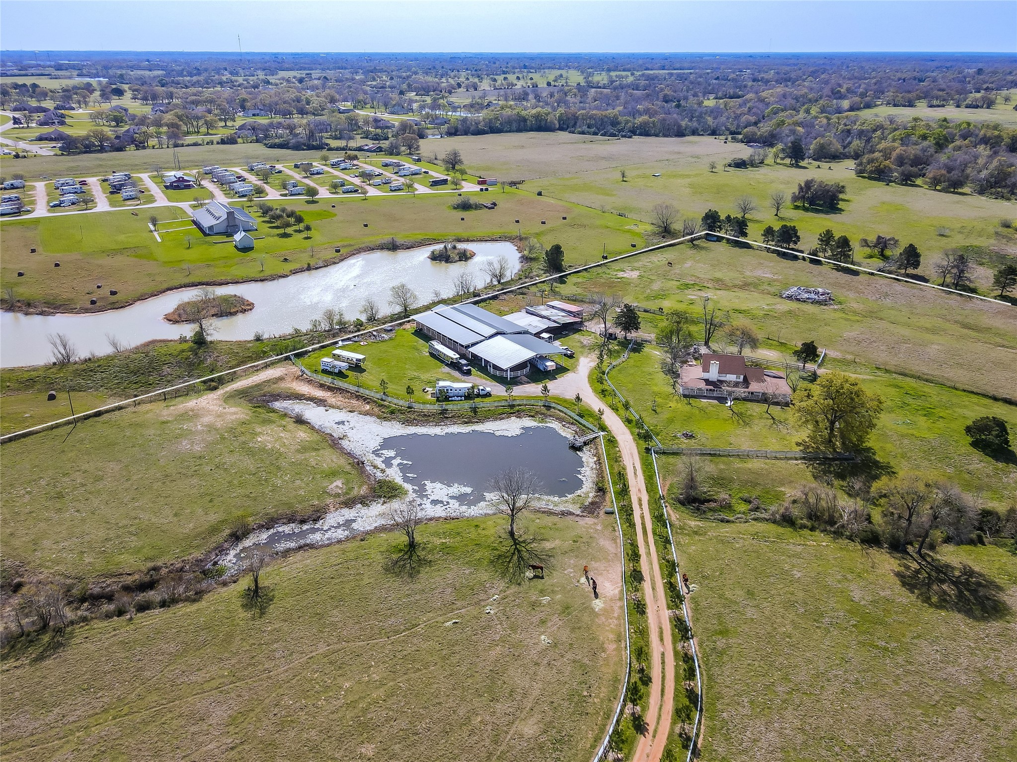 52825 Highway 290 Hempstead, TX 77445 - Photo 2 of 6 an aerial view of residential houses with outdoor space