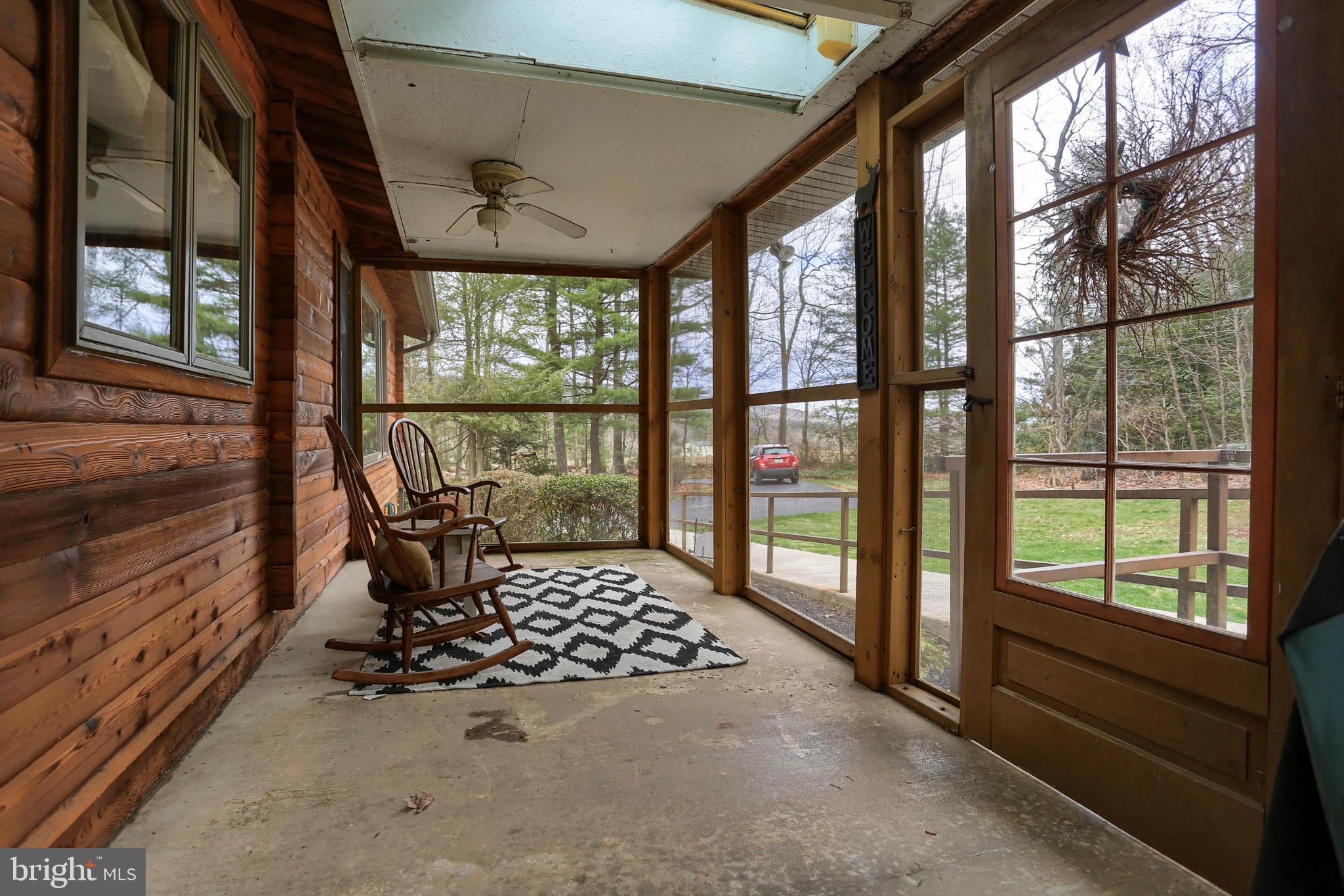 259 Buchanan Valley Road Orrtanna, PA 17353 - Photo 21 of 30 Screened in side porch