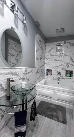 a bathroom with a toilet and a shower curtain