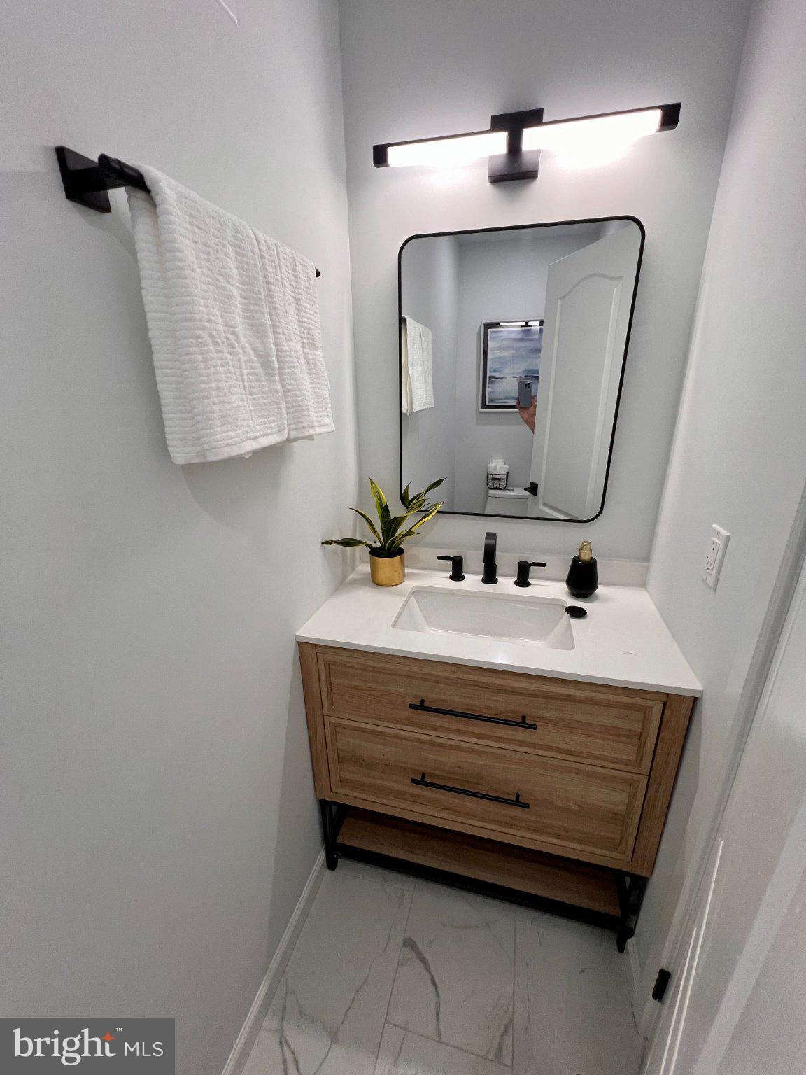 565 Hulmeville Road Langhorne, PA 19047 - Photo 22 of 32 Sleek modern bathroom with natural touches.