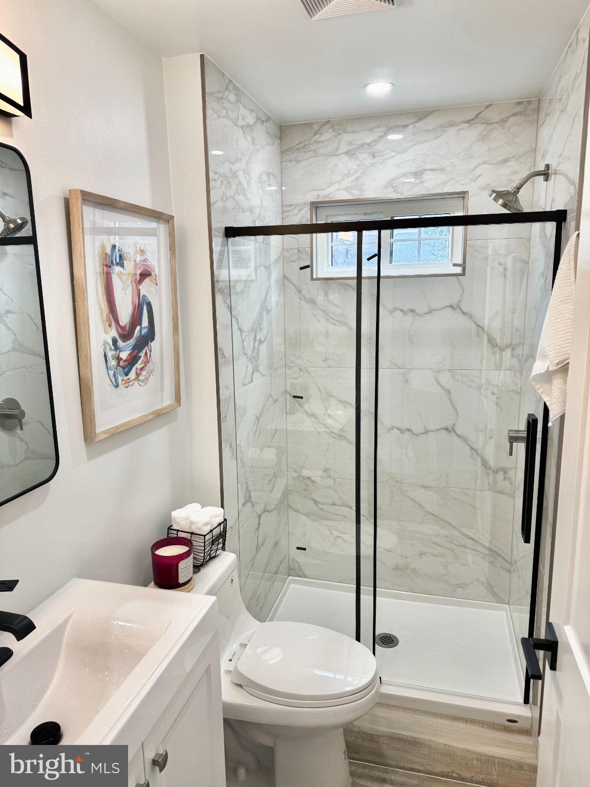 565 Hulmeville Road Langhorne, PA 19047 - Photo 23 of 32 Elegant marble-clad bathroom retreat.