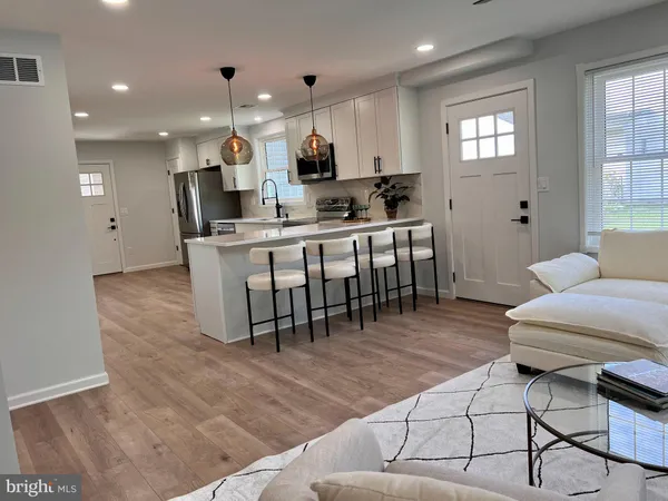 a kitchen with kitchen island granite countertop lots of counter top space and furniture