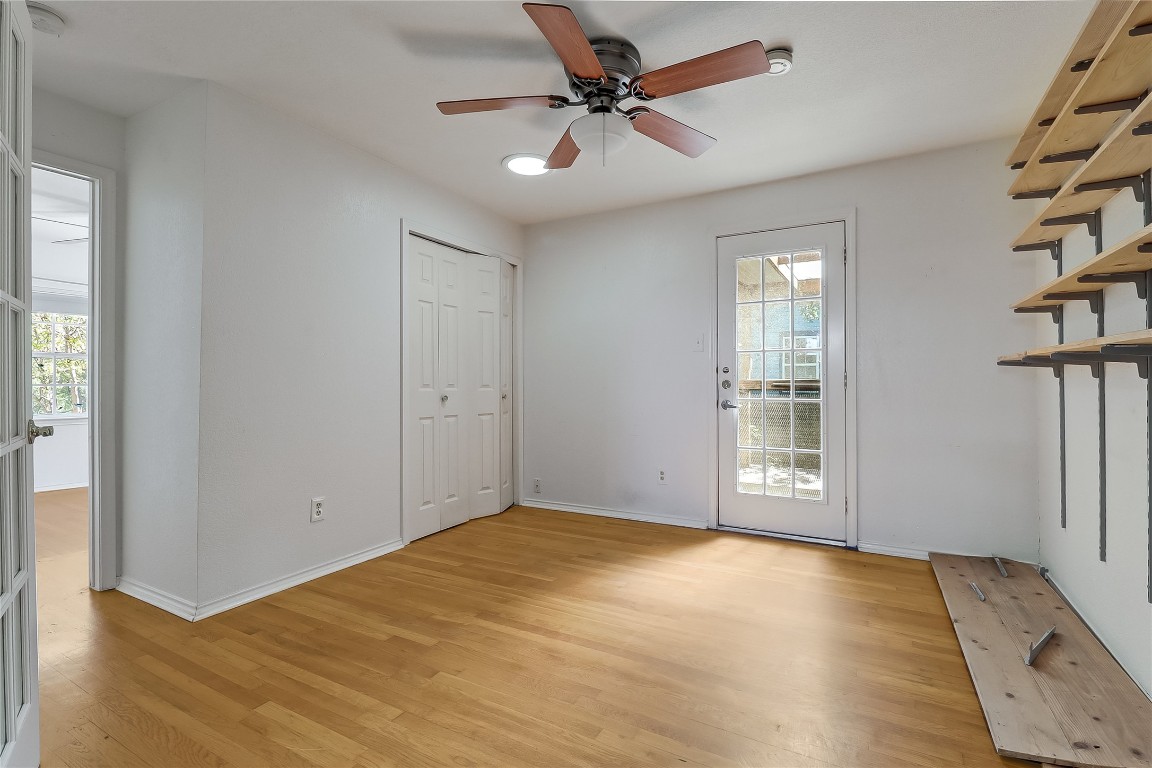 1706 Maple Avenue Austin, TX 78702 - Photo 13 of 30 an empty room with windows and fan
