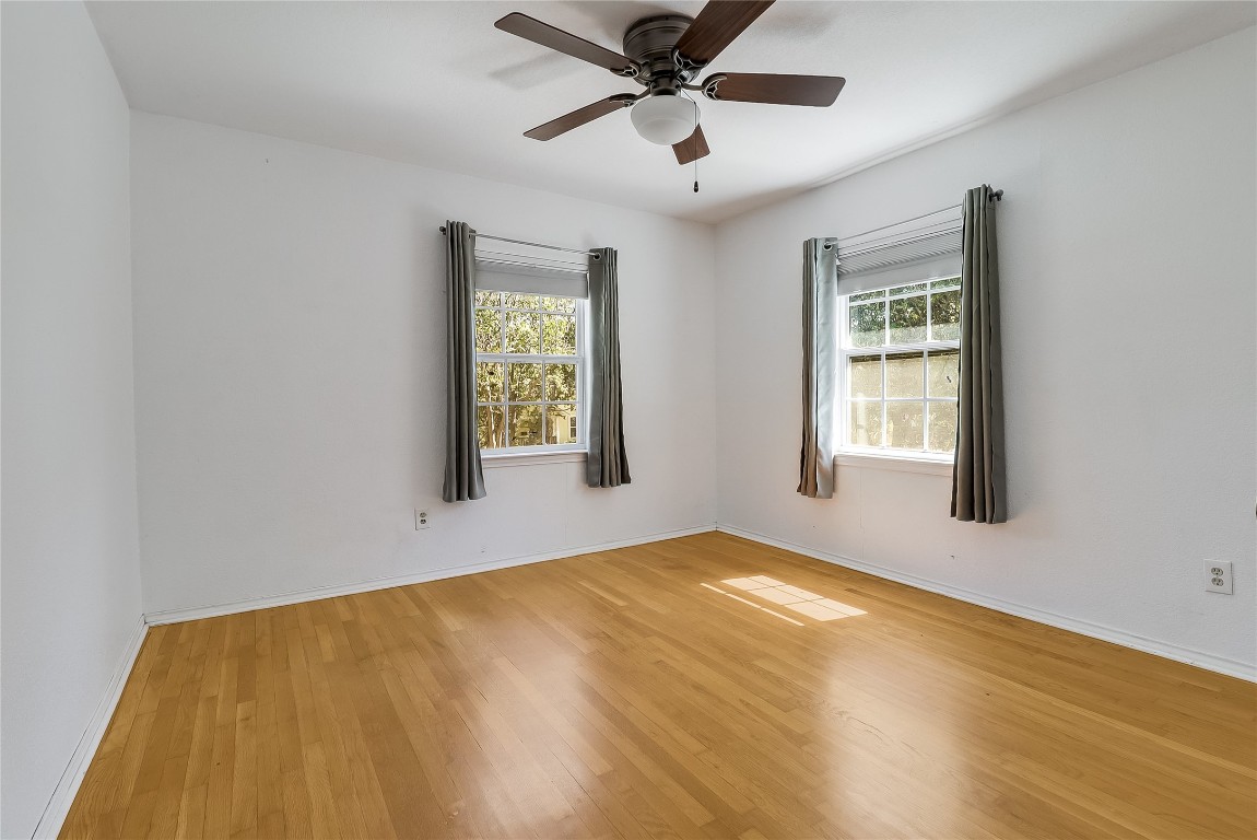 1706 Maple Avenue Austin, TX 78702 - Photo 14 of 30 a view of an empty room with window and wooden floor