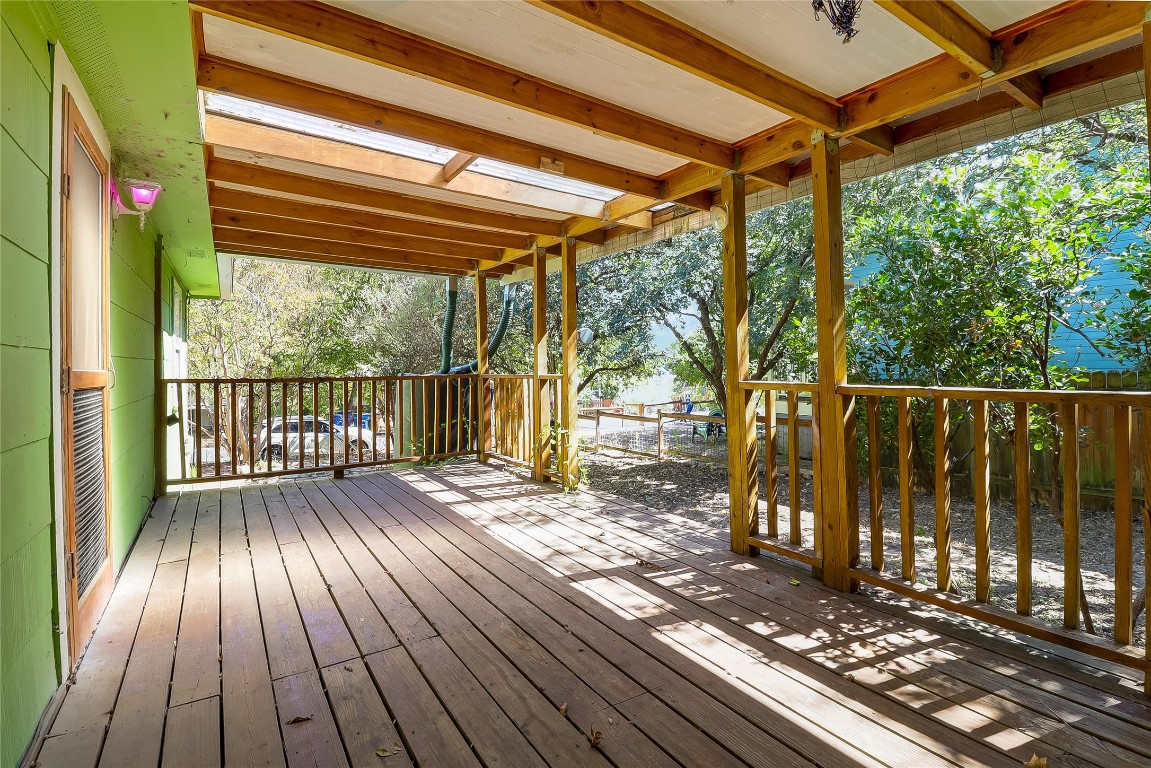 1706 Maple Avenue Austin, TX 78702 - Photo 19 of 30 a view of backyard with wooden floor and iron fence