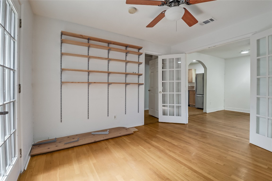 1706 Maple Avenue Austin, TX 78702 - Photo 9 of 30 a view of empty room with wooden floor and fan