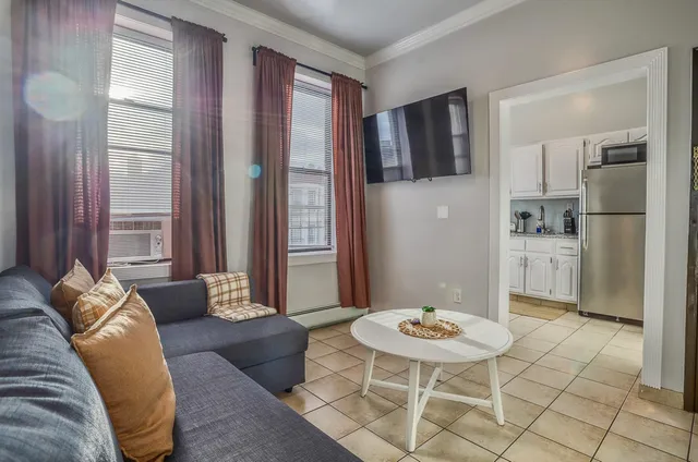 a living room with furniture and a table